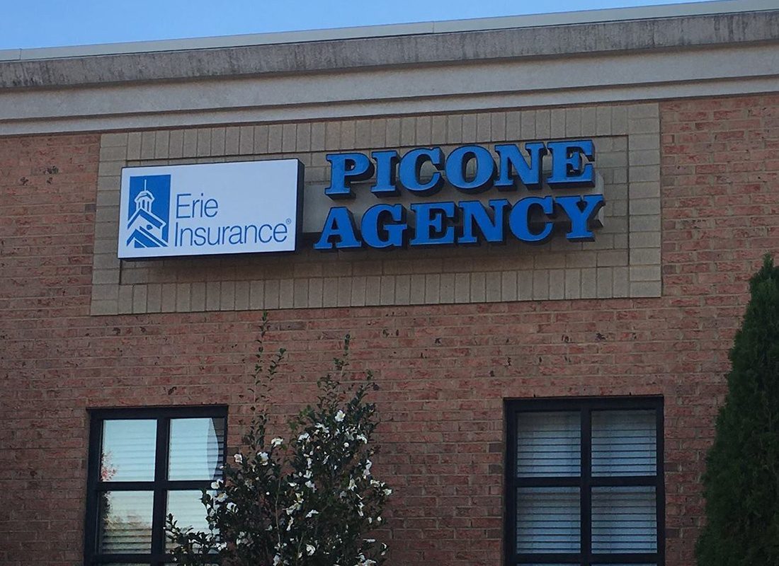 Contact - Exterior View of the Picone Insurance Agency Brick Building a Logo and Erie Insurance Sign